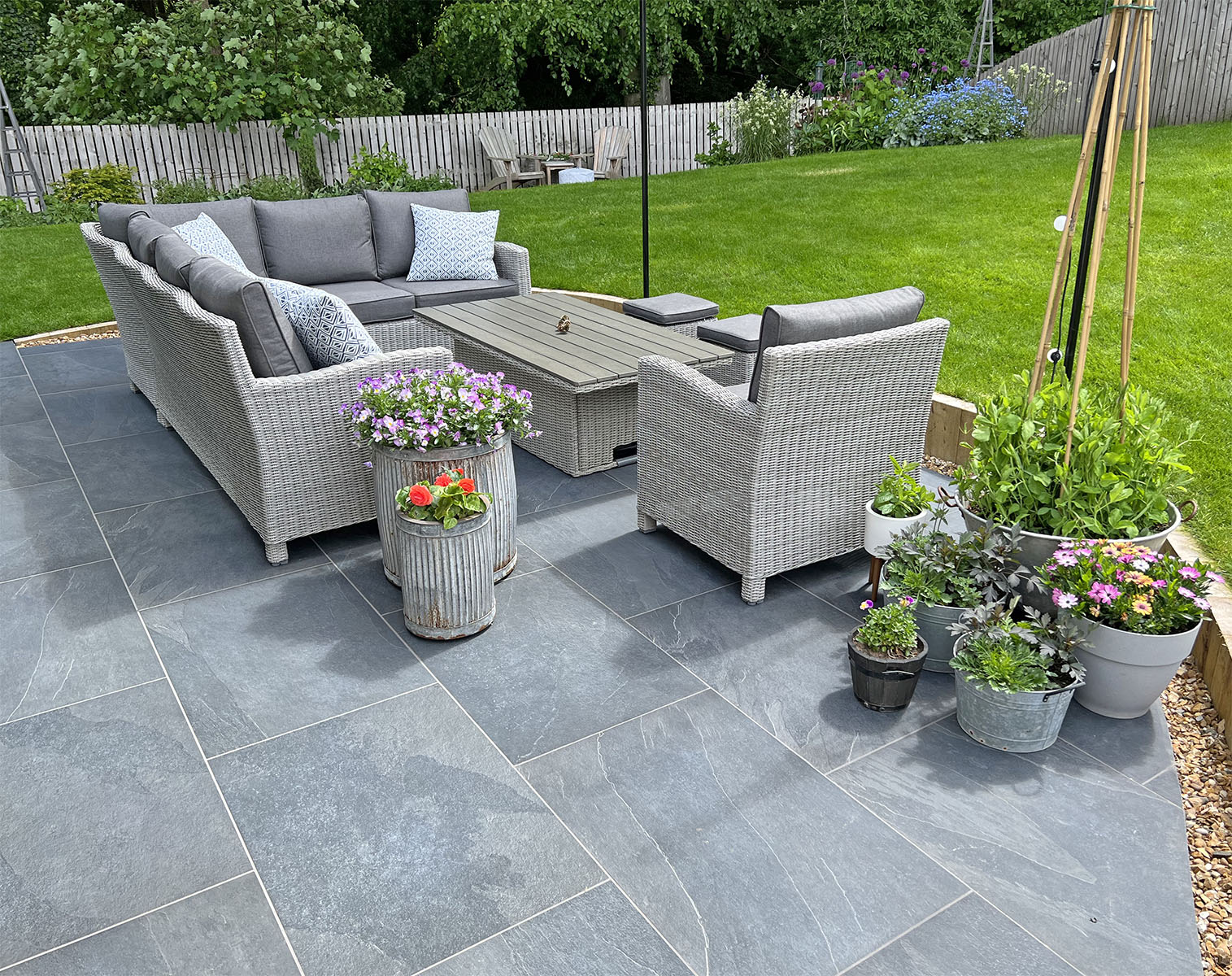 two-tone patio with blue and yellow porcelain paving
