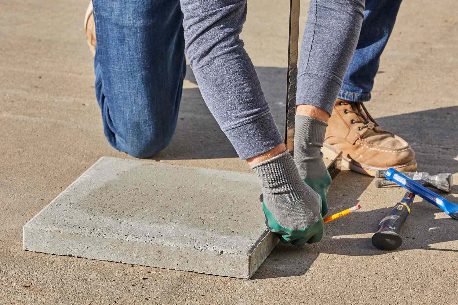 A workbench or a flat surface to Cut Patio Pavers