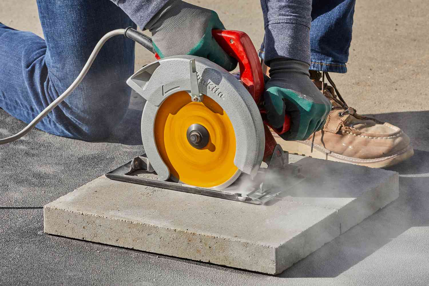 A power saw, such as an angle grinder or a circular saw to Cut Patio Pavers