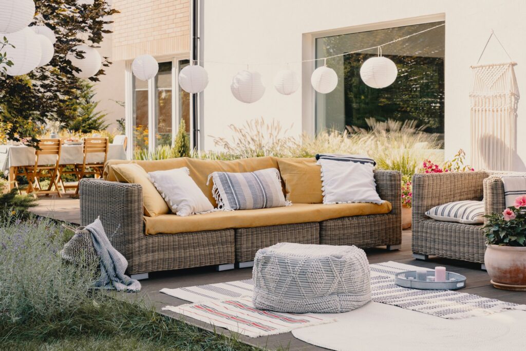 Throw pillows and blankets to your wicker patio furniture.