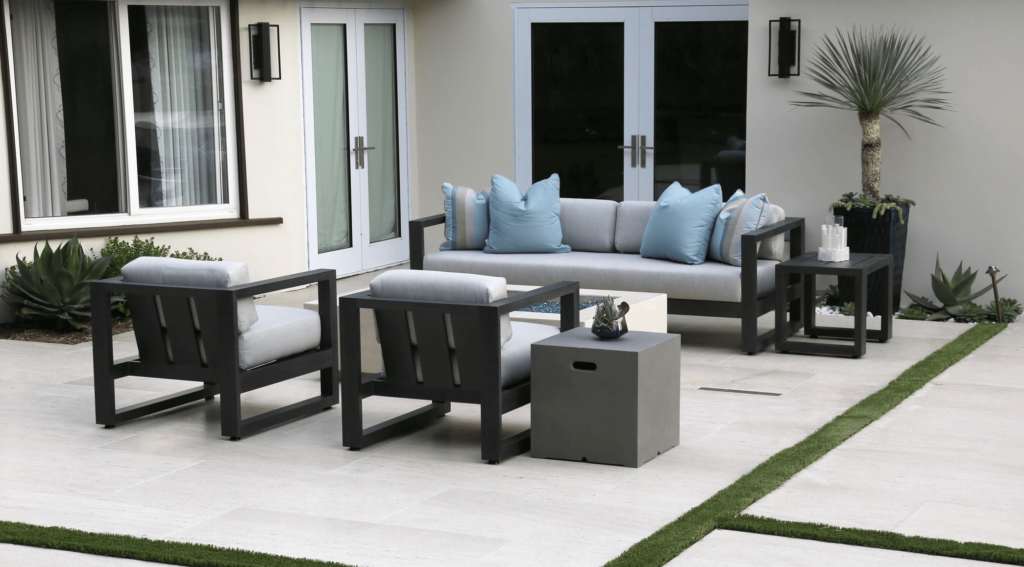 Create a comfortable seating area with cushions, pillows, and blankets outdoor